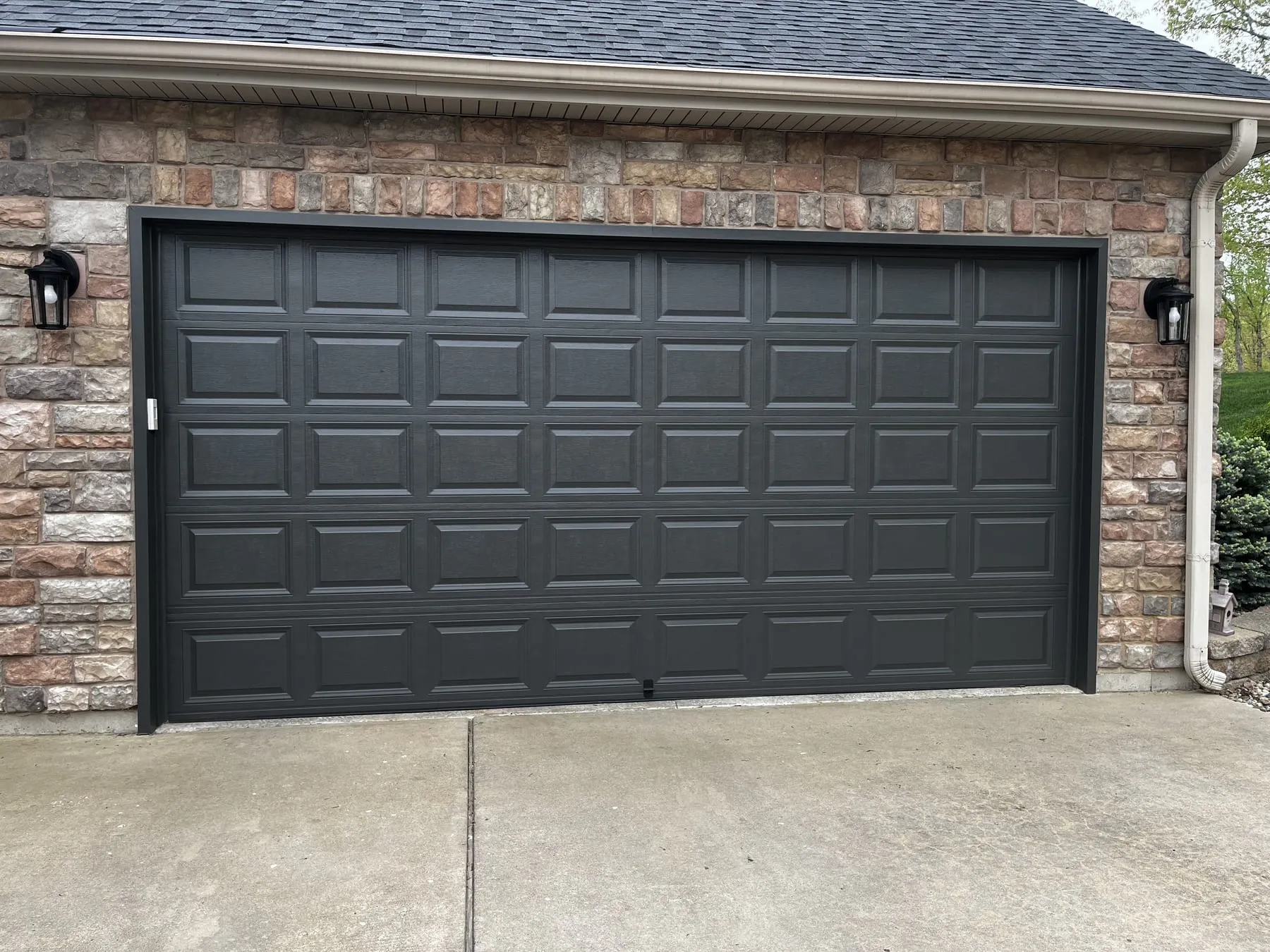 Garage door refinished in a bold modern black